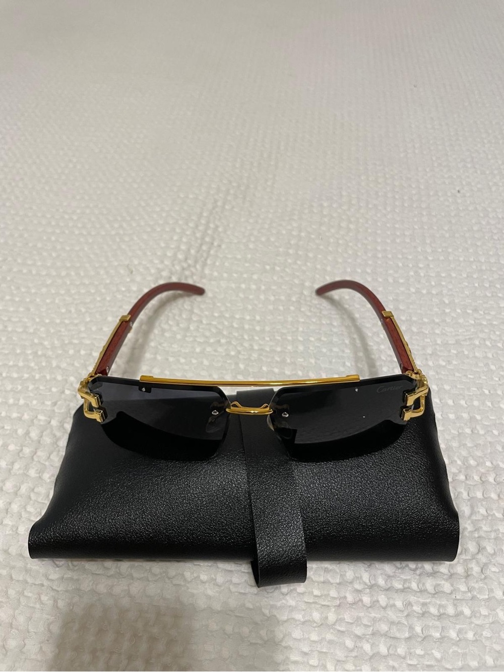 Cartier Gold Rimless Sunglasses with Black Lenses and Brown Temples